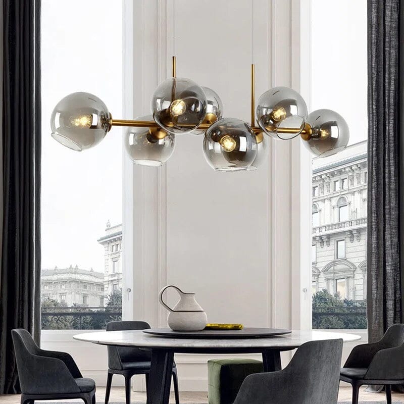 Iluminación colgante LED burbujas, estilo moderno, acabados lujosos en oro y negro.