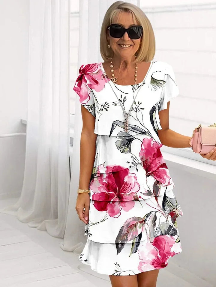 Vestido floral de mujer con volantes, elegante y fluido para primavera-verano. Ropa femenina cómoda.