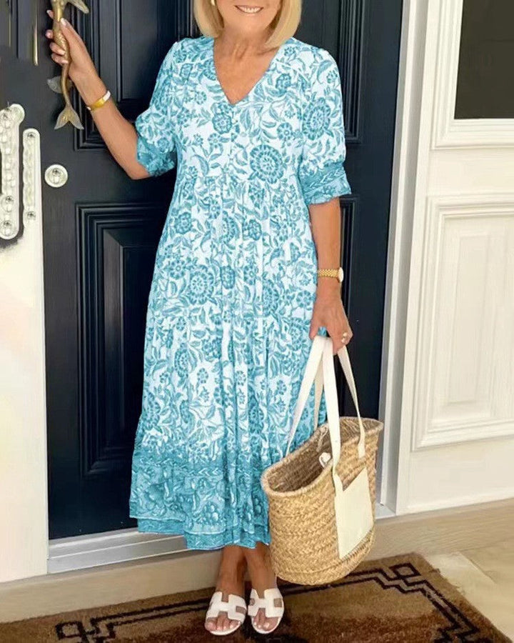 Vestido floral de mujer, diseño elegante y casual. Cuello en V, falda acampanada. Perfecto para cualquier evento.