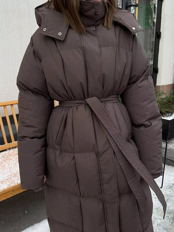 Abrigo elegante de mujer, acolchado, largo hasta la rodilla, con cinturón ajustable y cálido.