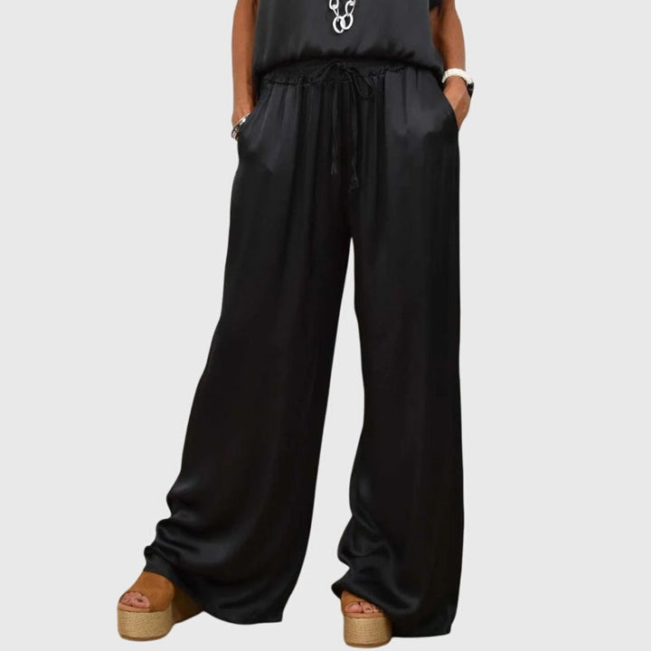 Conjunto moderno de dos piezas para mujer, pantalón ancho y camisa suelta. Moda versátil y fresca.