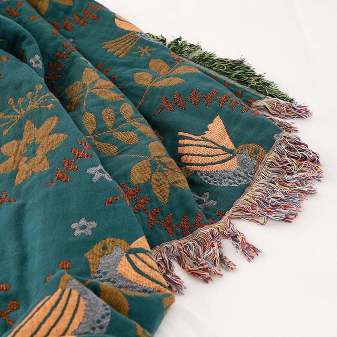 Manta decorativa escandinava de algodón, reversible, con diseño sutil de pájaros para añadir confort al hogar.