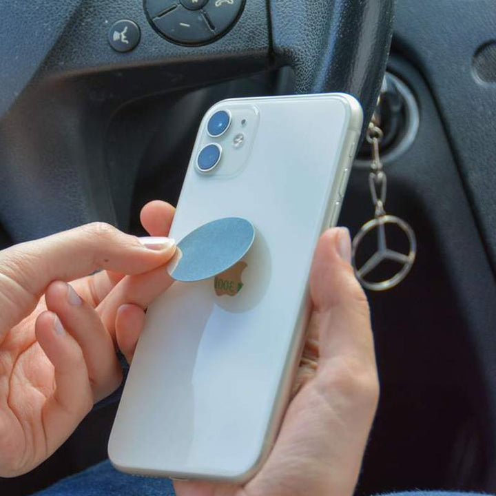 Práctico soporte magnético universal para teléfono móvil en la rejilla de ventilación del coche. Diseño compacto.