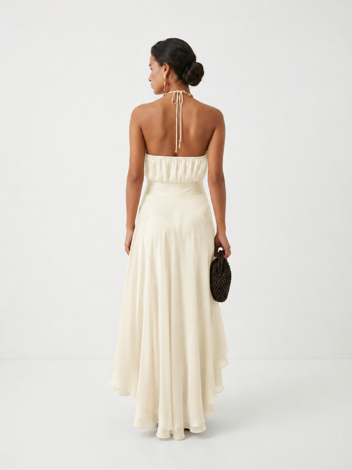 Vestido mujer elegante para fiesta, cuello halter, falda con volantes asimétricos, estilo moderno.