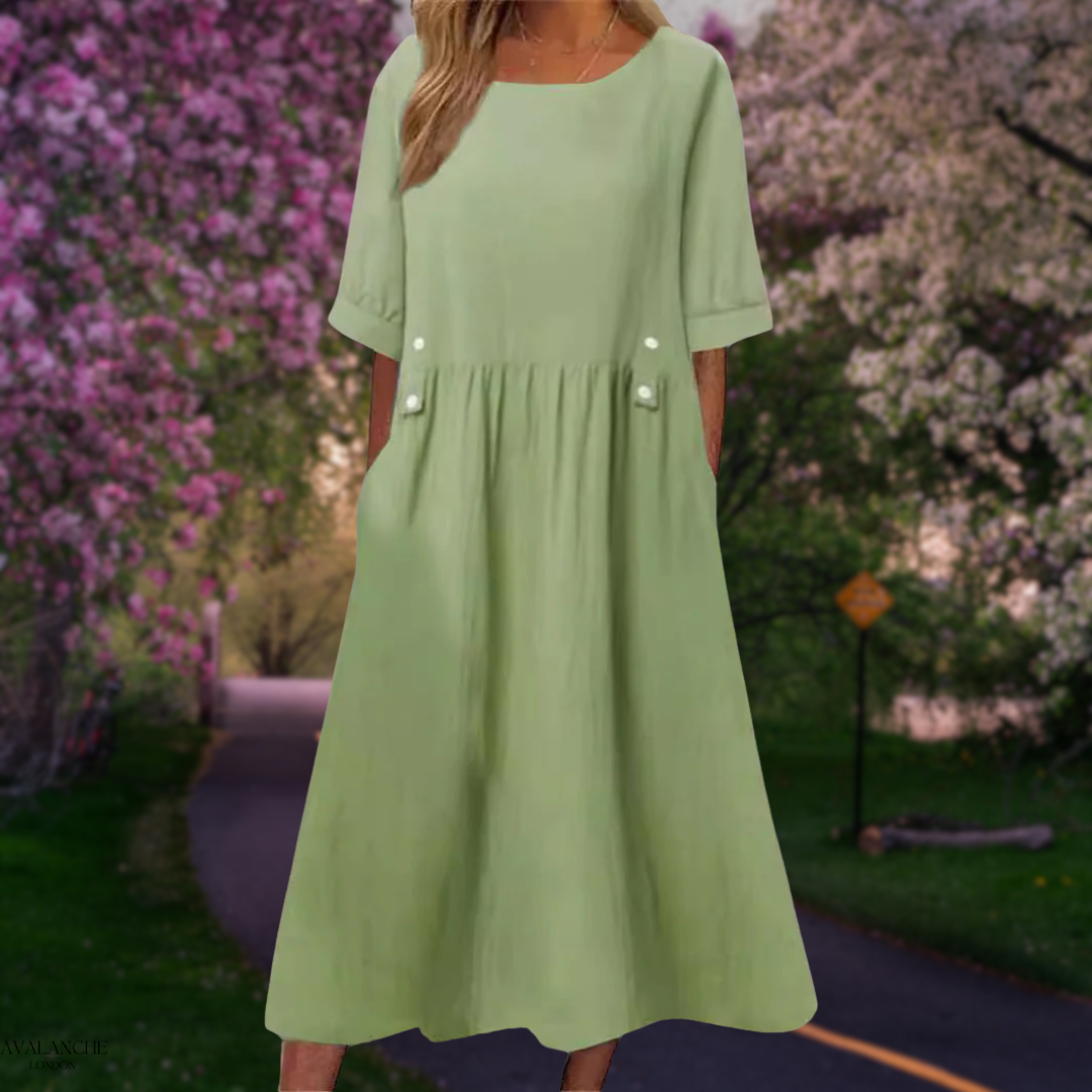 Elegante vestido midi fluido para mujer, versátil para looks casuales y sofisticados de verano.