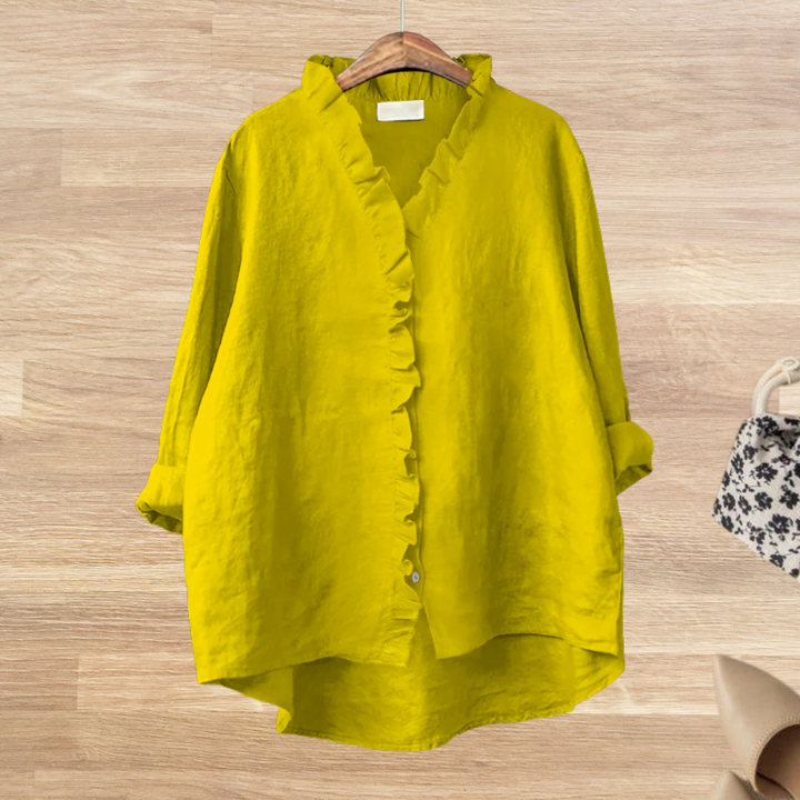 Blusa de mujer con volantes, caída fluida, manga larga. Prenda femenina chic para un look elegante.