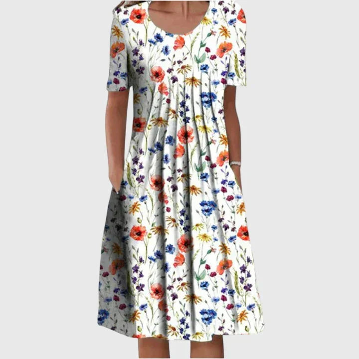 Vestido floral elegante para mujer, cubre vientre, ideal para verano y ocasiones casuales con estampado vibrante.