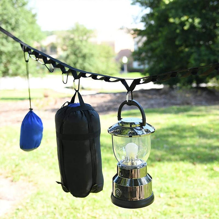 Cuerda colgante de camping con mosquetones, perfecta para organizar accesorios de senderismo y viaje al aire libre.