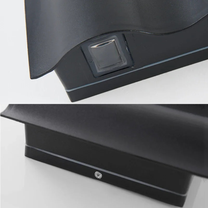 Aplique exterior LED, diseño ondulado, resistente, ideal para iluminación de jardines.