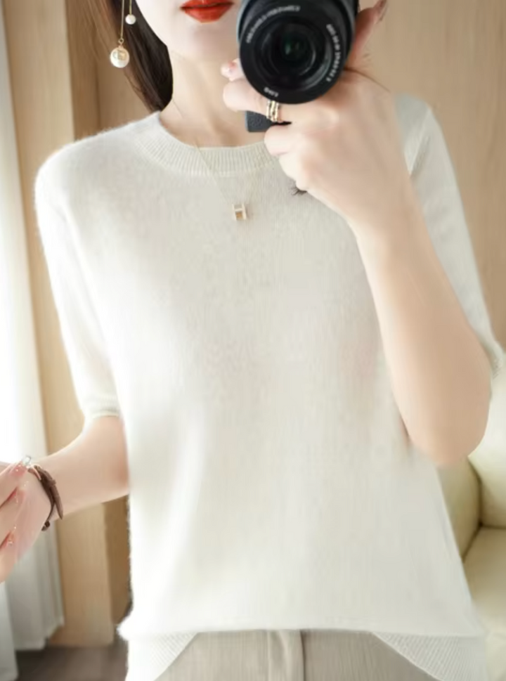 Suéter de oficina para mujer. Manga corta, estilo elegante y cómodo para un look profesional sofisticado.