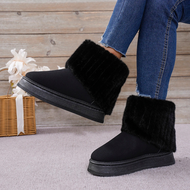 Botas de invierno cálidas para mujer, con forro suave y estilo impecable. Ideal para enfrentar el frío con elegancia.