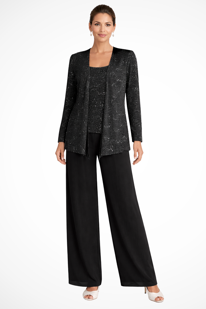 Chaquetilla de encaje con lentejuelas sobre pantalón elegante, estilo sofisticado para mujer.