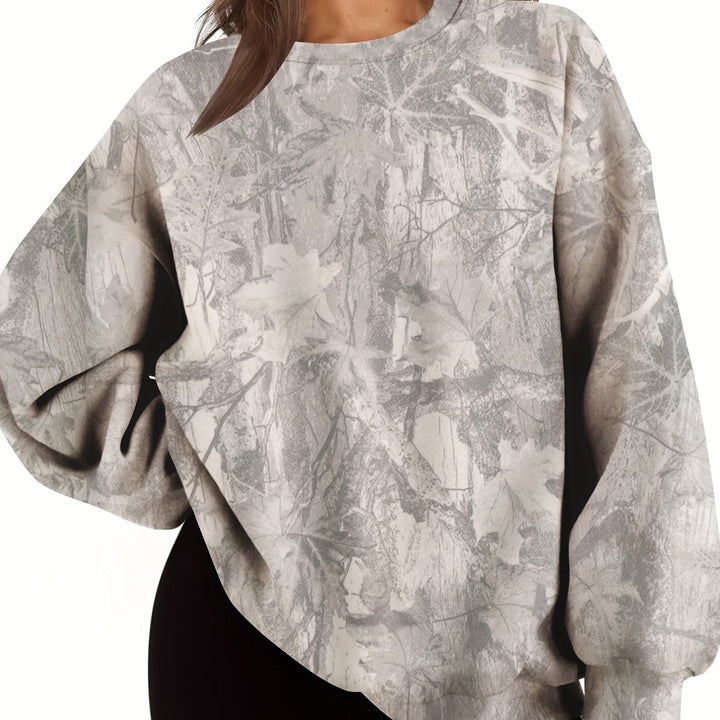 Jersey holgado camuflaje de mujer, con cuello redondo y puños. Sudadera oversize para moda urbana.