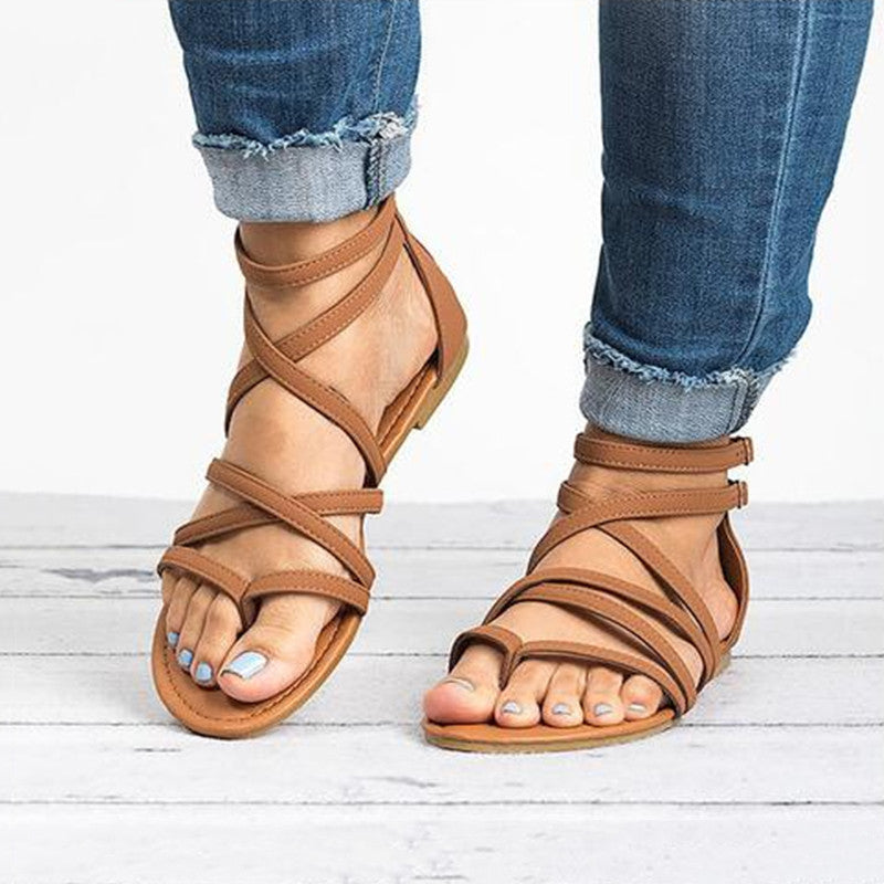Sandalias de mujer planas con correas cruzadas. Calzado veraniego versátil, ideal para comodidad y estilo casual.