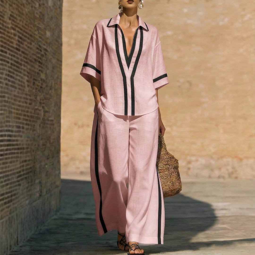 Modelo femenina con conjunto moderno de dos piezas, pantalón ancho y top, moda de verano para mujeres elegantes.