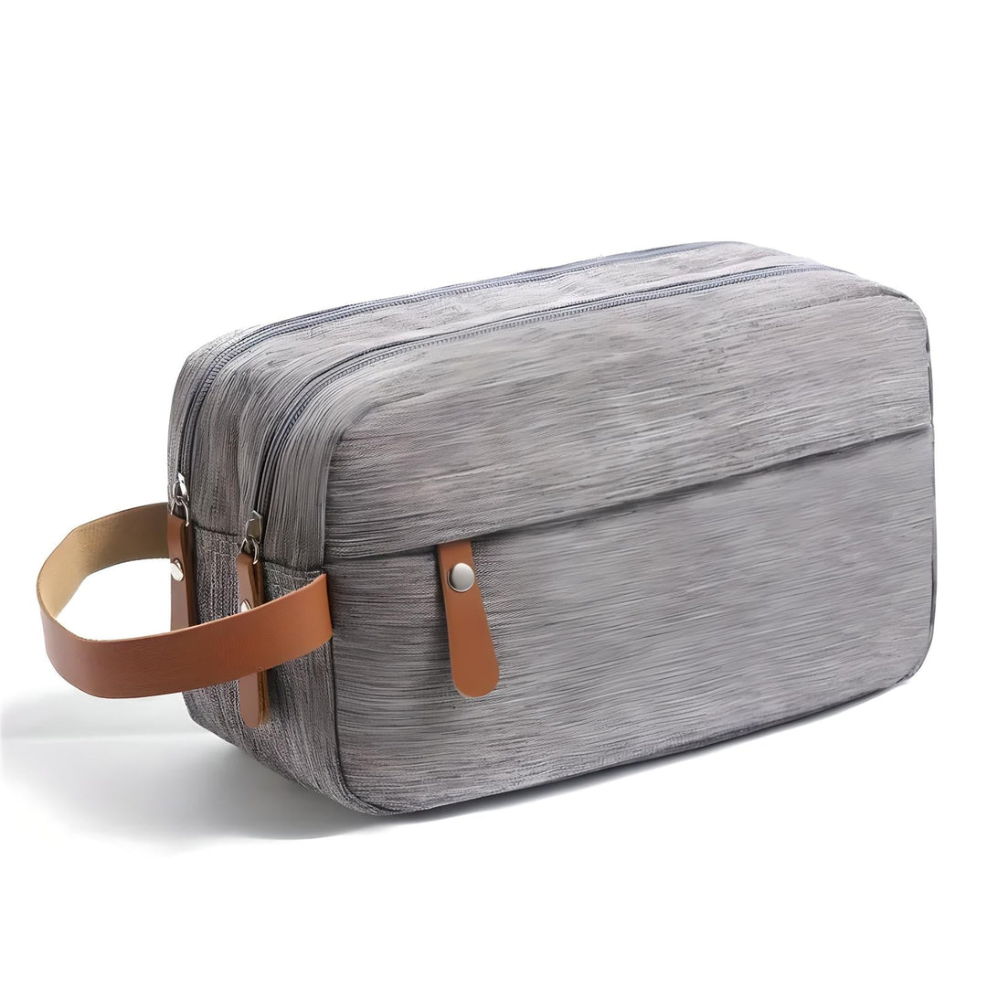 Neceser para hombre moderno, delgado. Organizador de viaje compacto y elegante para accesorios de aseo personal.