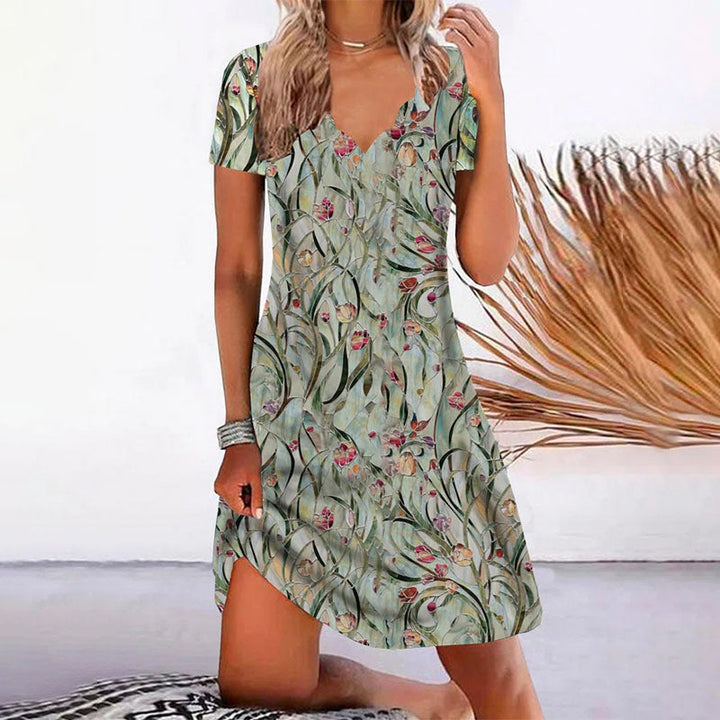Elegante vestido casual de verano para mujer, corte corto, estampado de hojas. Perfecto para días cálidos y cómodos.