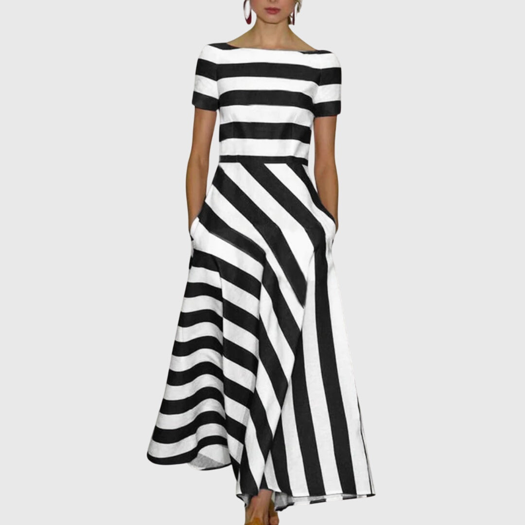 Vestido largo fluido de mujer con rayas, ideal para fiestas de verano. Estilo elegante, cómodo y femenino para moda versátil.