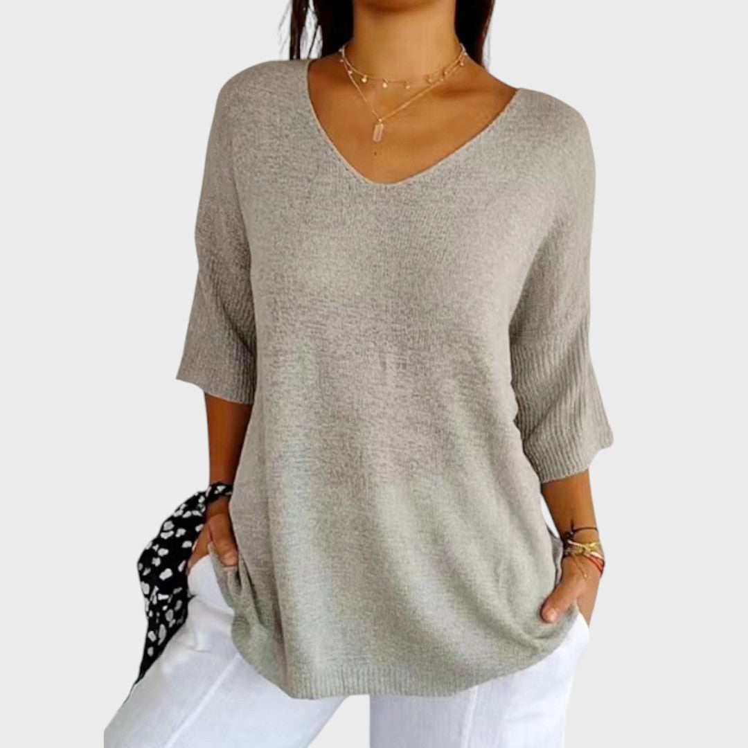 Suéter elegante de mujer con escote en V, ideal para look casual o formal. Tejido ligero y cómodo.
