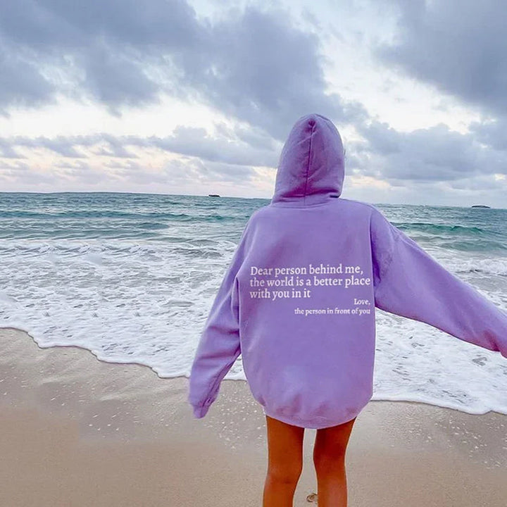 Sudadera SNOW para mujer en rosa pastel, vista lateral. Ropa de invierno cómoda y moderna, estilo pullover.