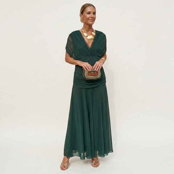 Vestido largo elegante fluido para mujer, ideal para eventos y celebraciones, con escote V y silueta estilizada.