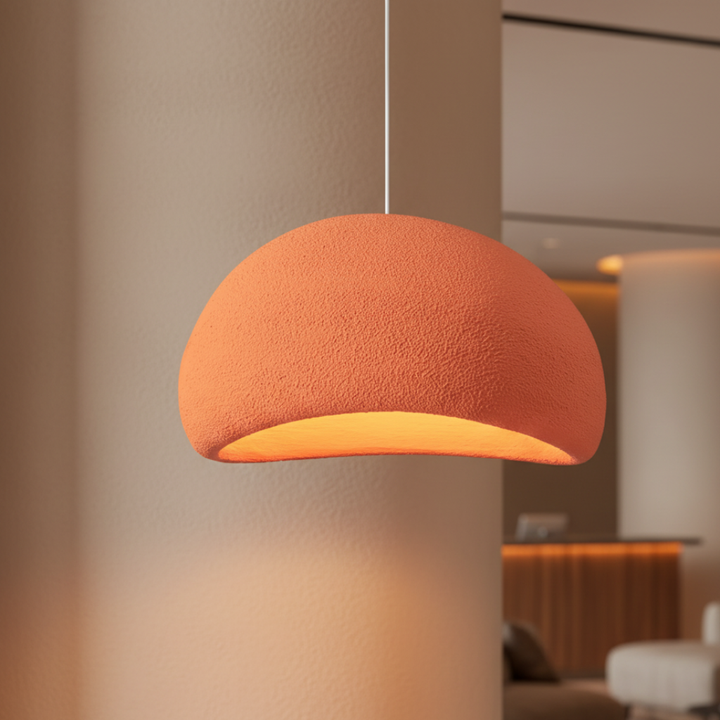 Diseño orgánico Galet Air, lámpara colgante que ofrece luz decorativa y cálida para espacios modernos.