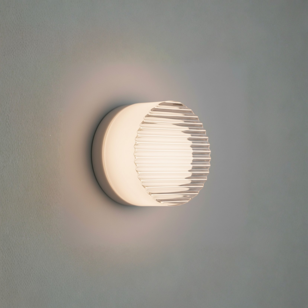 Foco de pared LED moderno, con textura suave y brillo ambiental, perfecto para la decoración minimalista.