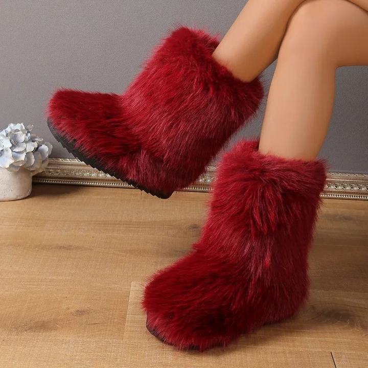 Suela antideslizante de botas de invierno para mujer, mostrando tracción. Máxima seguridad y agarre en superficies frías.