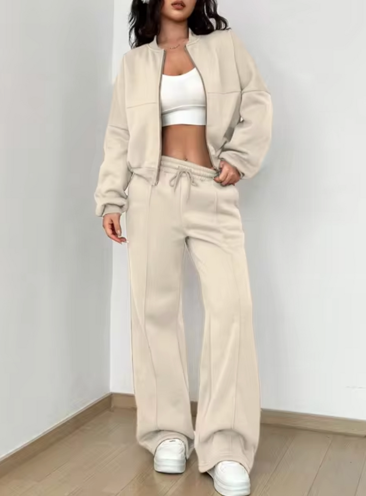 Conjunto casual de abrigo y jogging para mujer, ideal para looks de moda urbana en invierno.