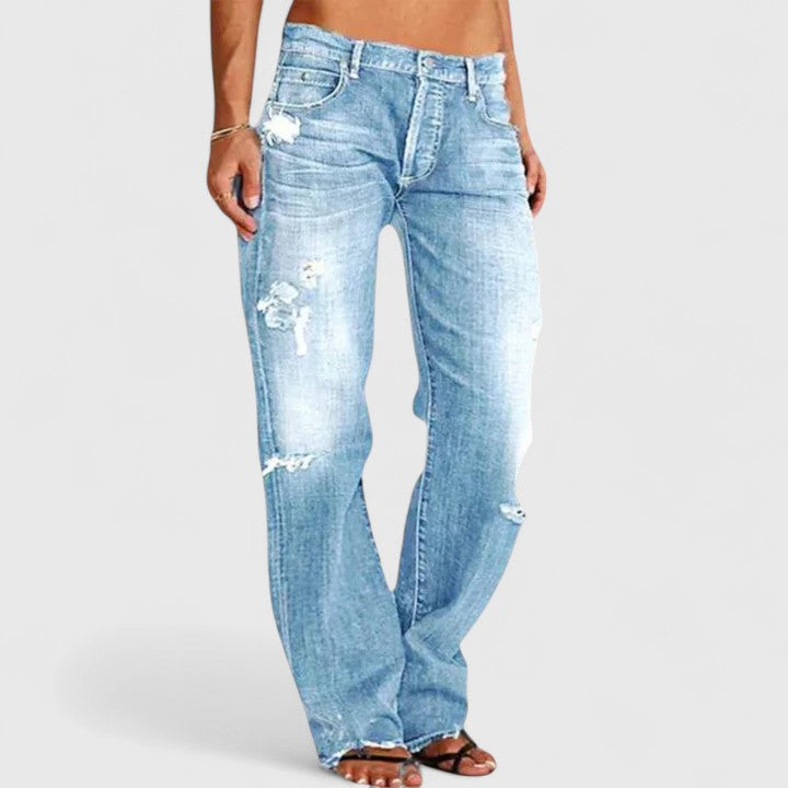 Vaqueros elásticos de mujer en azul denim, talle bajo y pierna ancha. Un estilo moderno y cómodo para tu día a día.