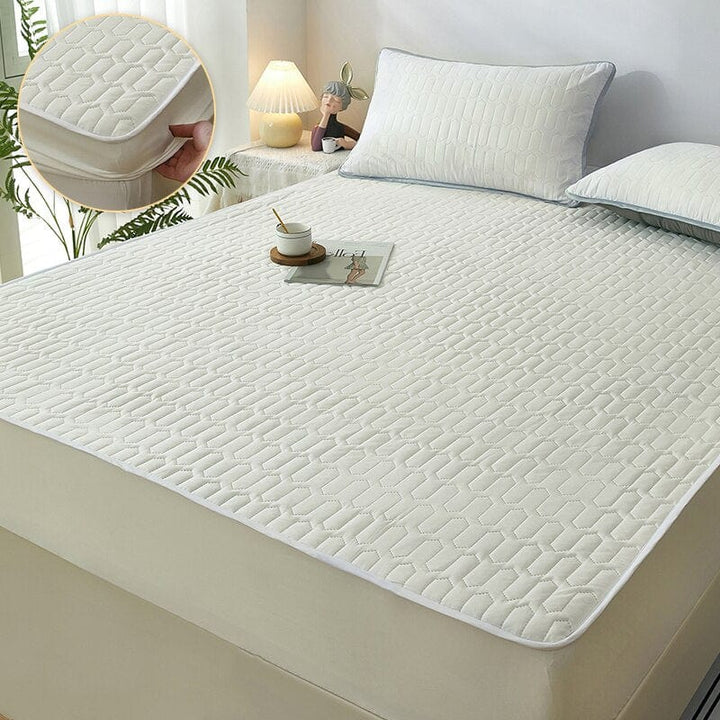 Protector de colchón impermeable y acolchado que promueve un descanso higiénico y suave en tu hogar.