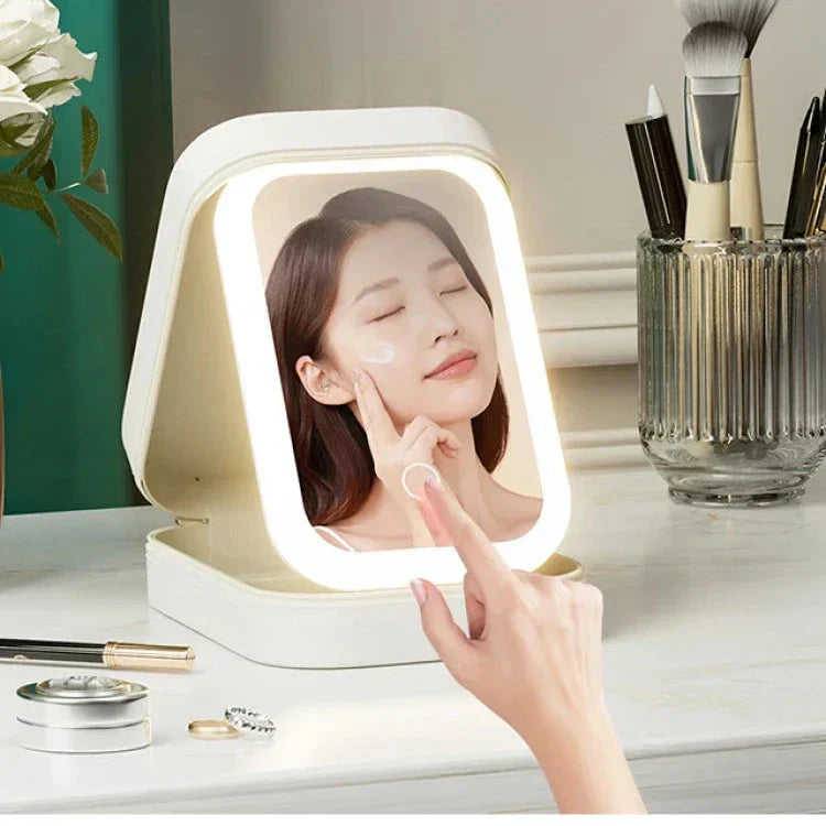 Espejo de belleza LED con luz regulable en neceser de maquillaje. Perfecto para aplicación de cosméticos.