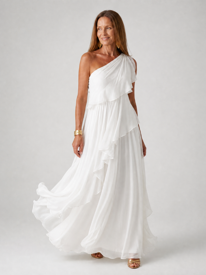 Vestido asimétrico maxi con volantes y falda fluida, moda elegante para mujer en rosa vibrante.