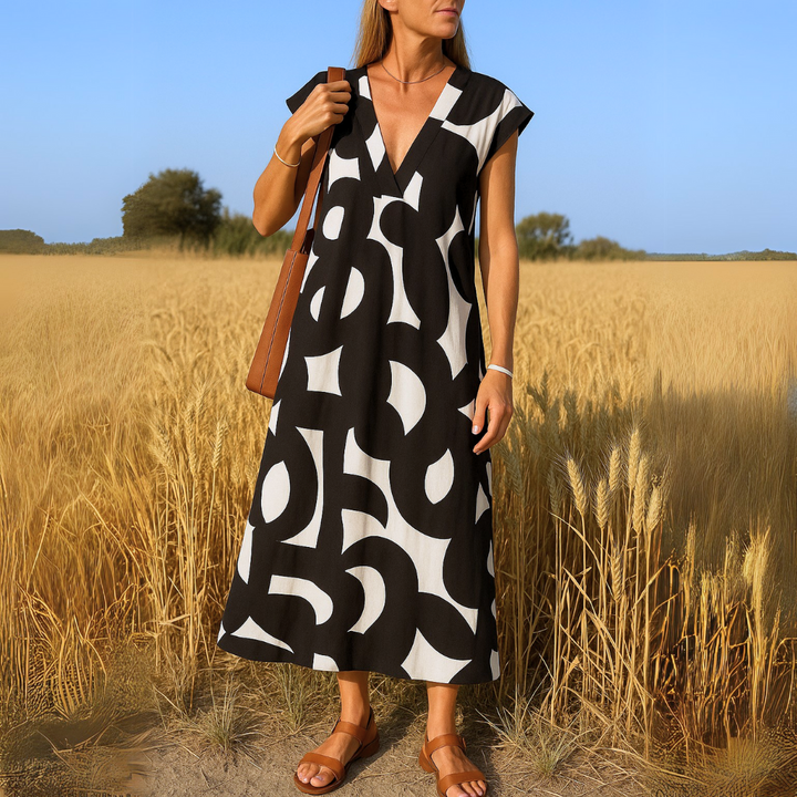 Vestido largo y fluido para mujer, con escote en V. Elegante y versátil, perfecto para fiesta o uso casual de verano.