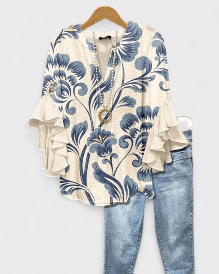 Blusa casual de mujer con diseño floral, cuello en V y volantes; perfecta para el verano.