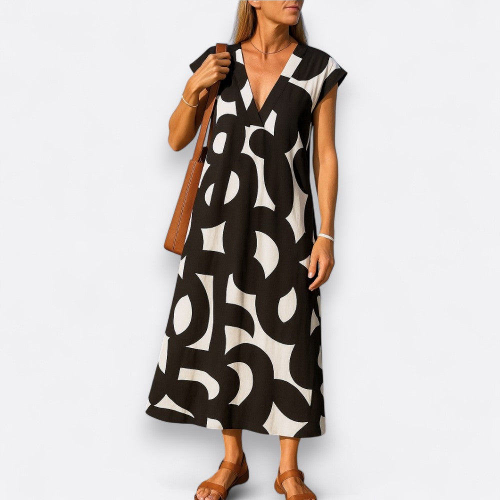 Vestido fluido de mujer con escote en V. Ideal para verano, elegante y cómodo para cualquier ocasión.