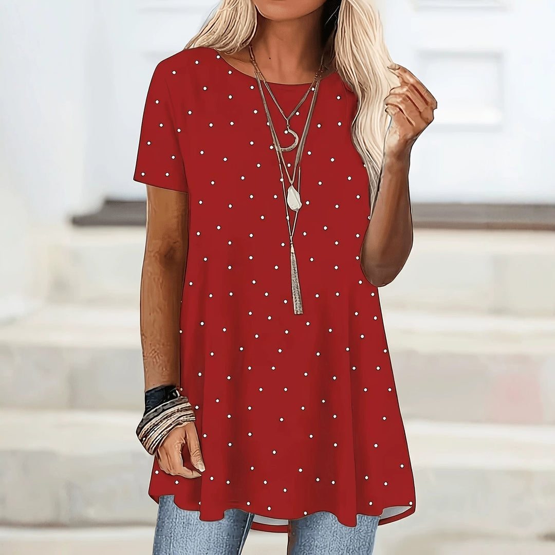 Blusa versátil de lunares para mujer, corte A favorecedor. Ideal para primavera/verano, casual o elegante.