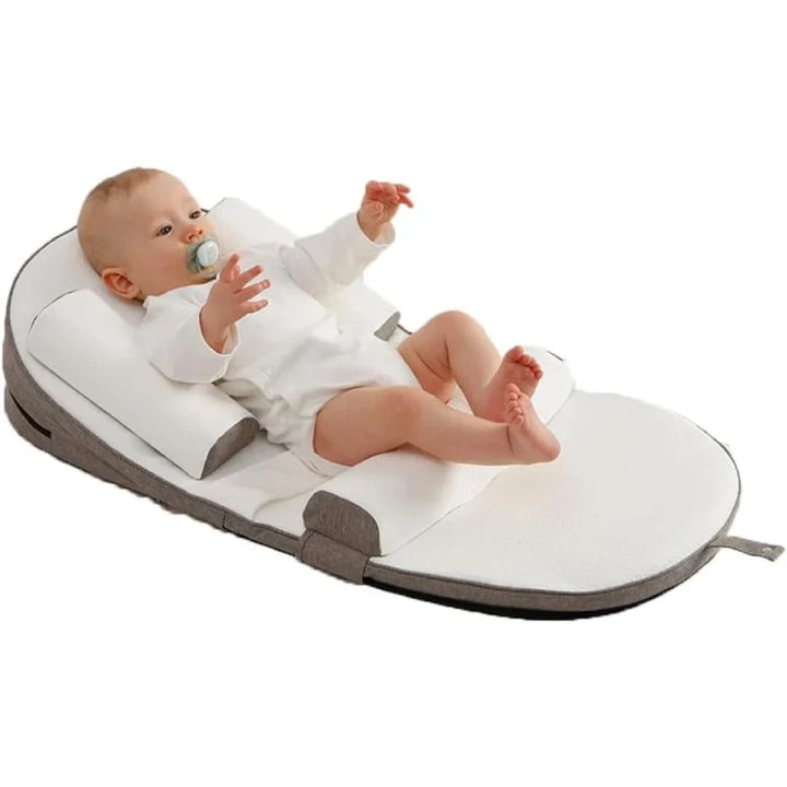 Almohada de maternidad adaptable para el descanso del bebé y recién nacidos. Soporte seguro antirreflujo y antivuelco.