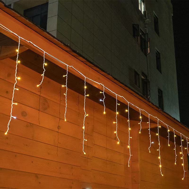 Cadenas luces LED carámbano cascada blanco cálido, 50m. Impermeable, perfecta para decoración exterior Navidad.