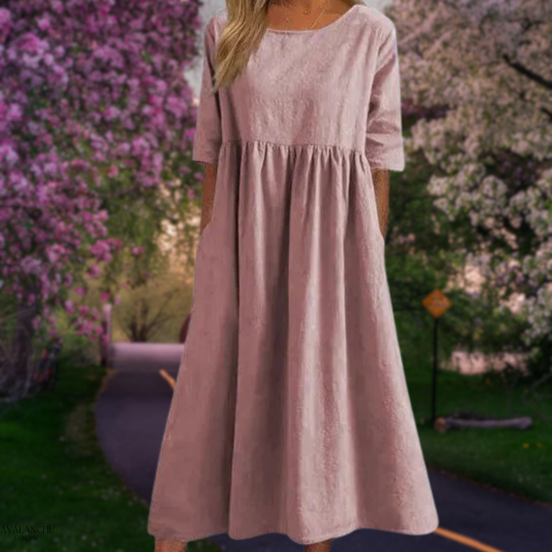 Vestido midi fluido de mujer en poliéster, con mangas medias y diseño holgado para el verano.