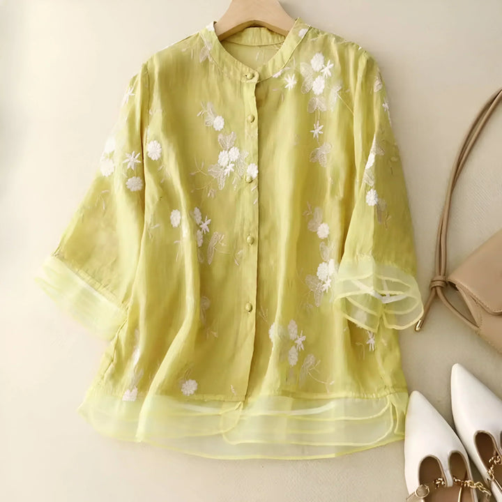 Elegante blusa Giovanna de algodón con estampado floral. Moda femenina y versátil para primavera y verano.