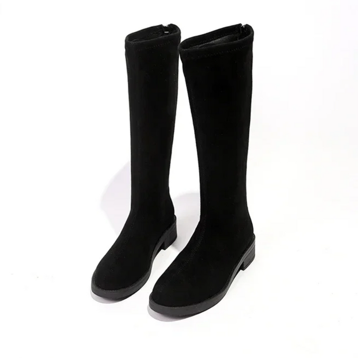 Botas altas negras para mujer, diseño minimalista y construcción ligera.