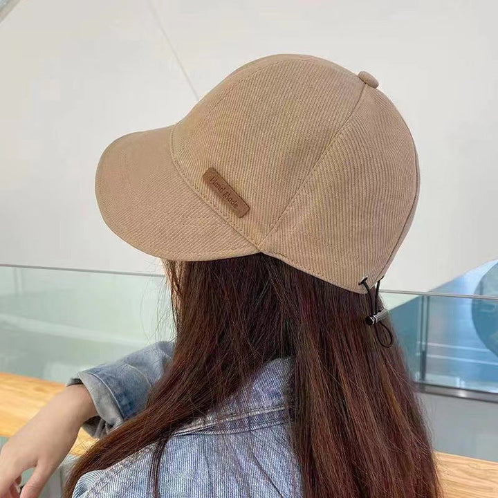Sombrero de sol UV negro para mujer, elegante y funcional para máxima protección.