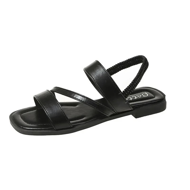 Calzado abierto de mujer, diseño minimalista y veraniego, ideal para un look elegante.