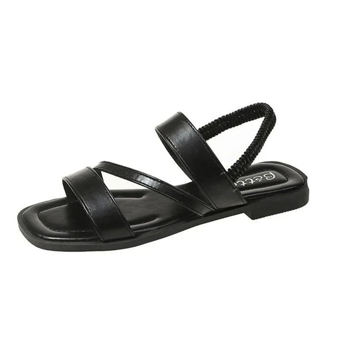Calzado abierto de mujer, diseño minimalista y veraniego, ideal para un look elegante.