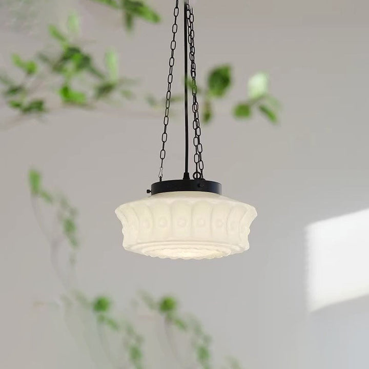 Elegante lámpara colgante LED cilíndrica, combinación de hierro y vidrio para interiores.
