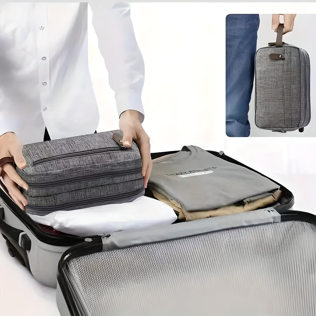 Neceser gris oscuro para hombre. Organizador de aseo personal de viaje, compacto y con estilo moderno.