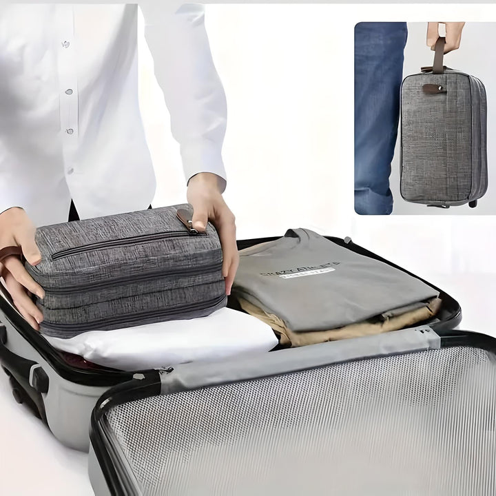 Neceser gris oscuro para hombre. Organizador de aseo personal de viaje, compacto y con estilo moderno.