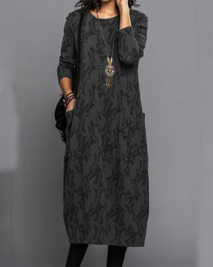 Vestido de mujer midi con manga larga. Silueta fluida y versátil, aporta elegancia casual para cualquier ocasión.