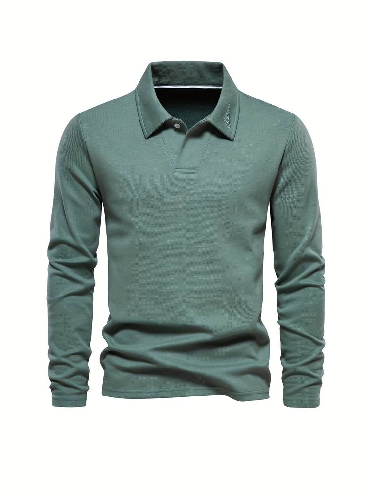 Polo de manga larga para hombre en tono gris. Prenda esencial de otoño invierno, combina elegancia clásica y confort diario.